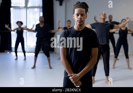 Mixed race modern male dancer looking at camera Stock Photo