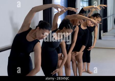 Group of female dancers practicing a dance routine in a studio Stock Photo
