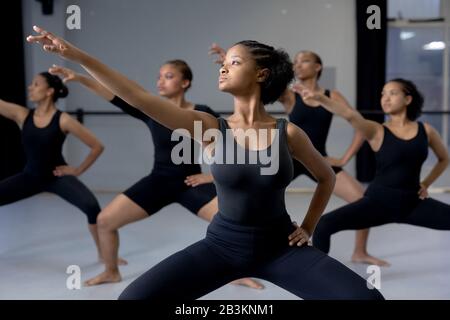 Group of female dancers practicing a dance routine in a studio Stock Photo