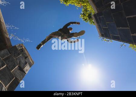 Caucasian man practicing parkour Stock Photo