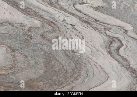 This is colorful,textured marble wall with gray and pink coloring. It is great background. Stock Photo