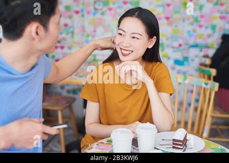 Young couple having happy time in a cafe Stock Photo