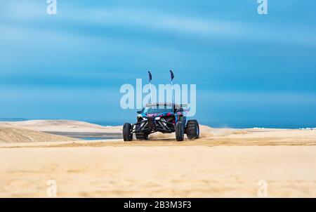 Sand Buggy racing in the sand dunes of the Qatari desert Stock Photo