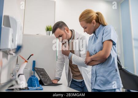 Image of two doctors looking at x-ray.Healthcare, medical and people concept. Stock Photo