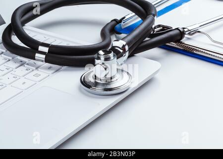 Stethoscope With Laptop on the table. creative photo. Stock Photo