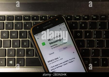 Installing WhatsApp messenger on smartphone screen pixelated close up view. Bucharest, Romania, 2020. Stock Photo