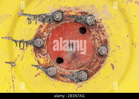 An agricultural machinery tire with on an yellow and red wheel Stock Photo