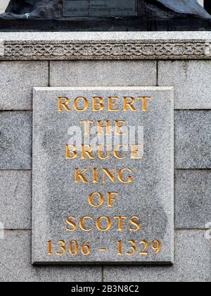 Plaque on the plinth of the Robert the Bruce Statue by Alan Beattie Herriot at Marishal College on Broad Street Aberdeen Scotland
