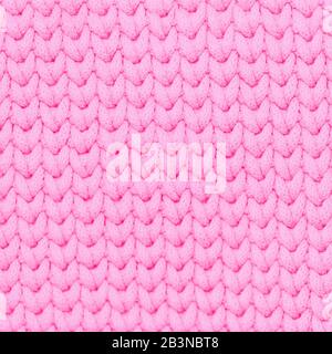 Pink color knitted fabric soft texture background Stock Photo