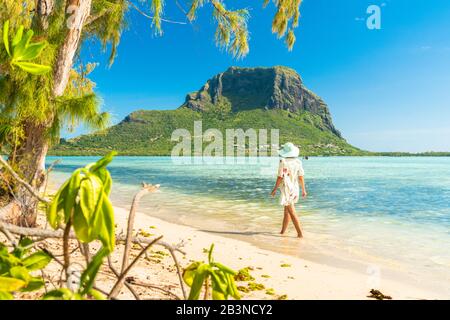 Woman walking on tropical sand beach, Ile aux Benitiers, La Gaulette, Le Morne, Black River, Mauritius, Indian Ocean, Africa