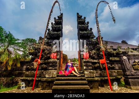 Woman posing for photo at the Besakih Temple, the largest and holiest temple of Hindu religion in Bali, Indonesia, Southeast Asia, Asia Stock Photo