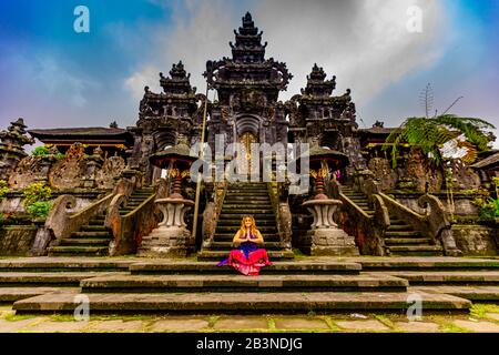 Woman at the Besakih Temple, the largest and holiest temple of Hindu religion in Bali, Indonesia, Southeast Asia, Asia Stock Photo