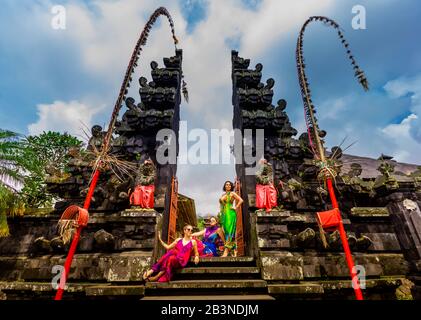 Women posing for photo at the Besakih Temple, the largest and holiest temple of Hindu religion in Bali, Indonesia, Southeast Asia, Asia Stock Photo