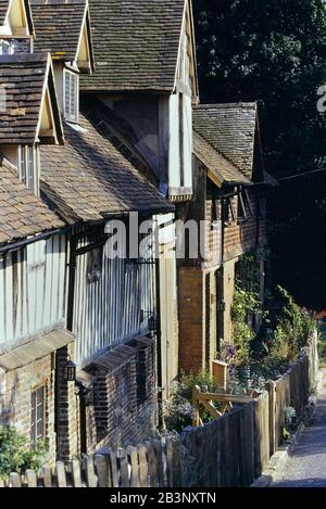 A row of historic cottages at Ightham Mote, Kent, England, UK Stock Photo