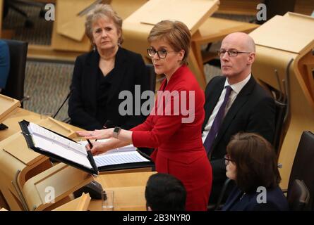 First Minister Nicola Sturgeon in the debating chamber during FMQs at the Scottish Parliament in Edinburgh. PA Photo. Picture date: Thursday March 5, 2020. See PA story SCOTLAND Questions. Photo credit should read: Andrew Milligan/PA Wire Stock Photo