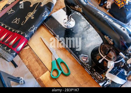 Sewing machine and African fabrics in seamstress workshop, Mozambique, Africa Stock Photo