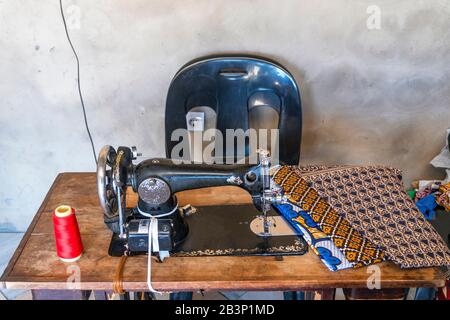 Sewing machine and African fabrics in seamstress workshop, Mozambique, Africa Stock Photo