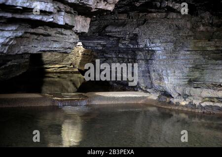 Spring water filled Jack Daniel Cave where the limestone filtered spring water is the using for distilling Jack Daniel whiskey in Jack Daniel Distillery.Lynchburg.Tennessee.USA Stock Photo