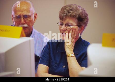 Austin, TX:    Texas senior citizens participate in a geneaology class using the Internet at SeniorNet, a non-profit organization to help seniors learn new technology. 4/00  MR ©Bob Daemmrich/ Stock Photo