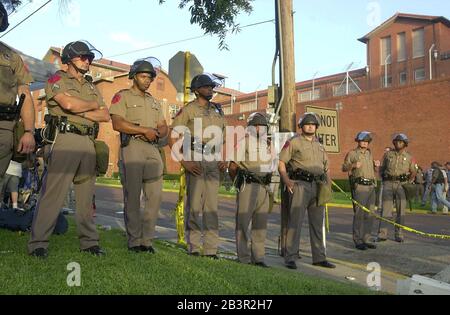 Huntsville, Texas USA, 22JUN00: Scenes outside the Walls Unit of the Texas Department of Corrections in downtown Huntsville during the execution of convicted murderer Gary Graham.  Two dozen protesters were arrested after crashing a police barricade as the execution occurred. These are troopers in riot gear from the Texas Dept. of Public Safety .©Bob Daemmrich Stock Photo