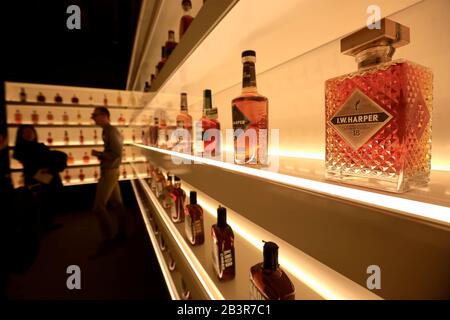 Visitors in the Bottle Hall it showcase every brand of bourbon currently produced in the state of Kentucky.Frazier History Museum. Louisville. Kentucky.USA Stock Photo