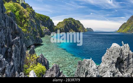 El Nido, Palawan, Philippines. Tapiutan strait with tourist boats. View from Matinloc island located in Bacuit Archipelago Stock Photo