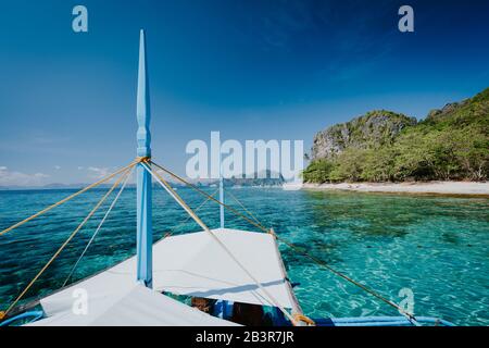 Boat trip to tropical islands El Nido, Palawan, Philippines. Discover exploring unique nature island, journey to paradise Stock Photo