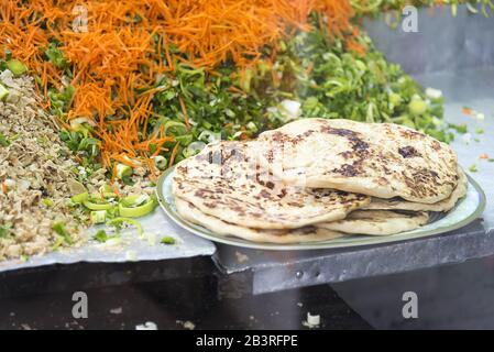 Nuwara Eliya, Sri Lanka: Traditional fast food stall selling flat bread and vegetables. Stock Photo