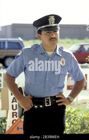 Edinburg, Texas USA: Hispanic police officer on duty in South Texas. ©Bob Daemmrich Stock Photo