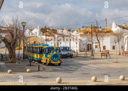 Guadix, Spain - January 10, 2020: Tourist road train on a city street, province Granada, Andalusia Stock Photo