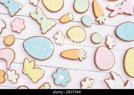 Easter greeting card with gingerbread cookies. Easter spring decorative composition with homemade easter cookies in shape of funny rabbit and eggs Stock Photo