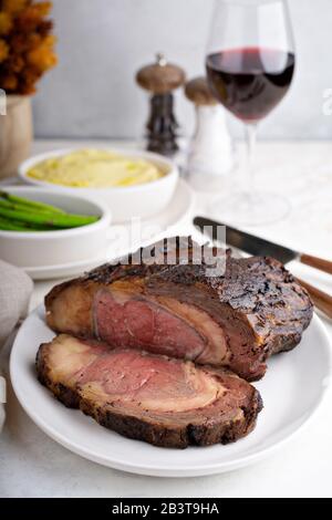 Sunday roast beef sliced on a plate with mashed potatoes an asparagus Stock Photo