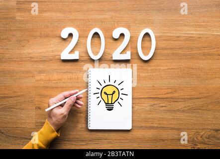2020 creativity inspiration concepts with lightbulb on notepaper.Business ideas. Stock Photo