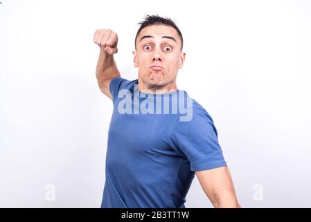 Man looking violently forward about to punch him. On white background Middle plane Stock Photo