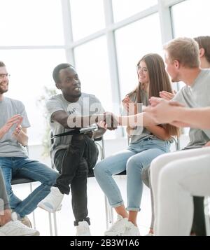 group of young people greeted the speaker with their applause Stock Photo
