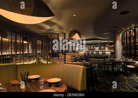 Restaurant seating areas looking towards bar and lounge area and wine wall. Campbelltown Catholic Club, Sydney, Australia. Architect: Scott Carver, 20 Stock Photo