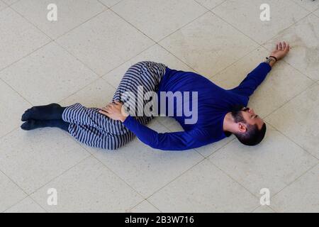 Male dancer laying on the floor, Sephardic Hebrew Center, Plaza de la Revolucion, Vedado, Havana, Cuba Stock Photo
