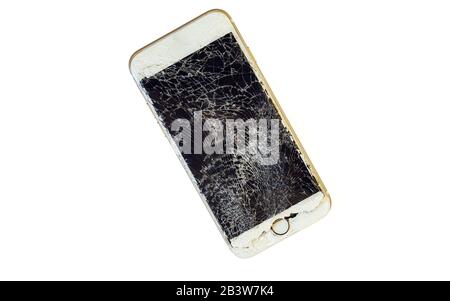 Modern smartphone with highly broken screen isolated on white background. Stock Photo