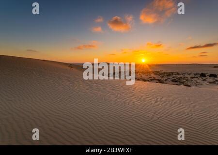 Sand dunes in the National Park of Dunas de Corralejo during a beautiful sunrise- Canary Islands - Fuerteventura Stock Photo