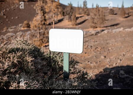Sign board with blank space on the rocky land Stock Photo