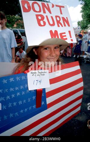 Austin, Texas USA: American flag-burning issue comes to Fourth of July parade. ©Bob Daemmrich Stock Photo