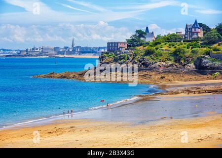 Sand beach on atlantic Emerald coast in Dinard, with view of St Malo town, Brittany, France Stock Photo