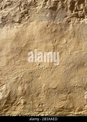 Background image of a painted plaster wall outdooors. Image made on mobile phone Stock Photo