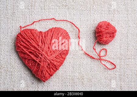 Red heart shape symbol made from wool Stock Photo