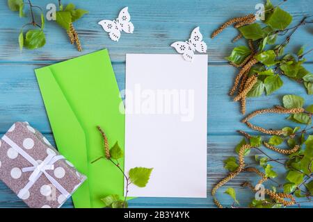 Mock up blank of a spring blank with birch branches on an aged blue background. Email form template. Spring frame for text, greetings, promotions Stock Photo