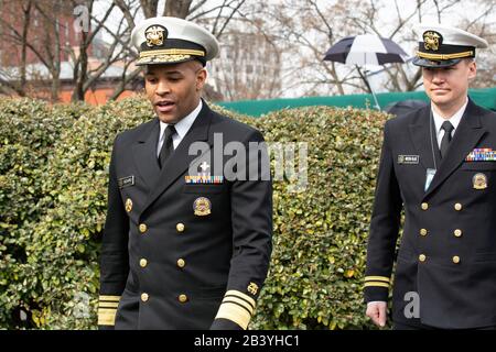 United States Surgeon General Jerome M. Adams, left, walks away after speaking during a television interview outside the White House in Washington D.C., U.S., on Thursday, March 5, 2020.  Credit: Stefani Reynolds / CNP /MediaPunch Stock Photo
