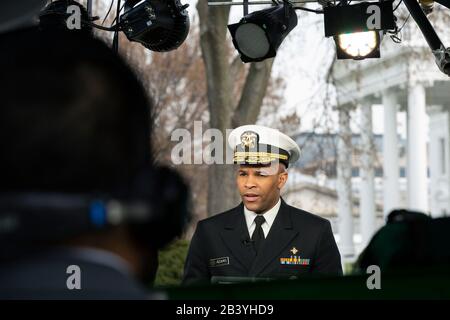 United States Surgeon General Jerome M. Adams speaks during a television interview outside the White House in Washington D.C., U.S., on Thursday, March 5, 2020.  Credit: Stefani Reynolds / CNP /MediaPunch Stock Photo