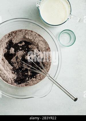 dry ingredients in a baking bowl. mixing products Stock Photo