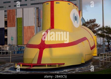 4 February 2020: The Beatles' Yellow Submarine model / sculpture outside the Liverpool John Lennon Airport with the Hampton Hotel in the background. Stock Photo