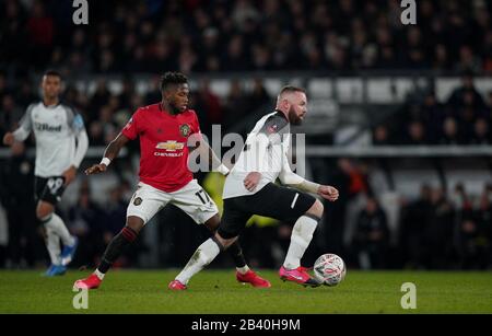 Derby, UK. 05th Mar, 2020. Wayne Rooney of Derby County turns Fred of Man Utd during the FA Cup 5th round match between Derby County and Manchester United at the Ipro Stadium, Derby, England on 5 March 2020. Photo by Andy Rowland. Credit: PRiME Media Images/Alamy Live News
